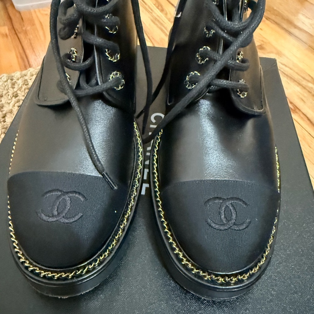 CHANEL Black Leather Boots with Gold Stitching